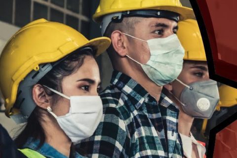 Employees wearing mask and and yellow cap and standing in one line