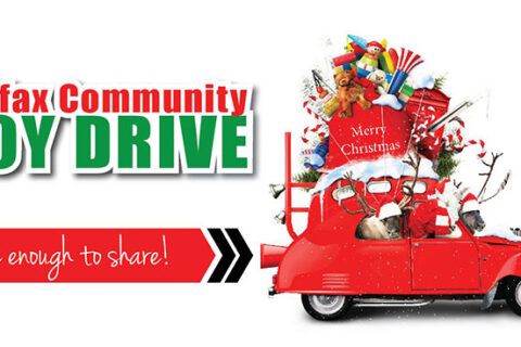 a red car with Christmas gift tied above and text colfax community toy drive care enough to share written