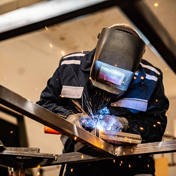 worker working with welding tool