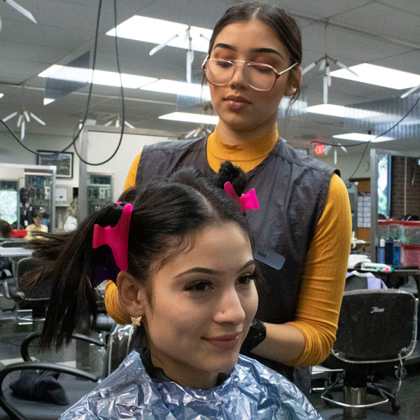 person doing another person's hair