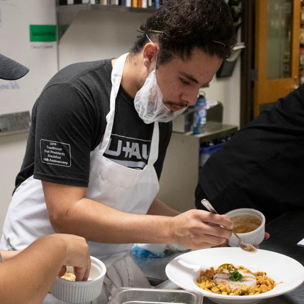 Culinary students in the kitchen learning