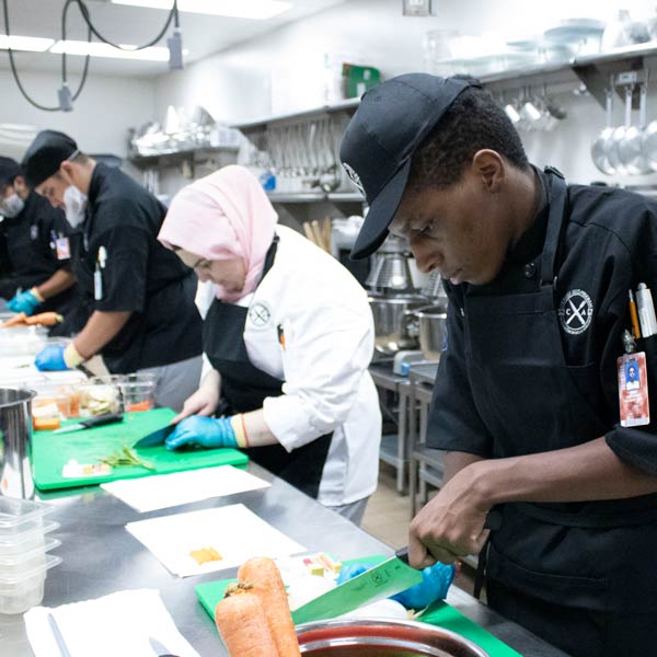 Culinary students in the kitchen learning