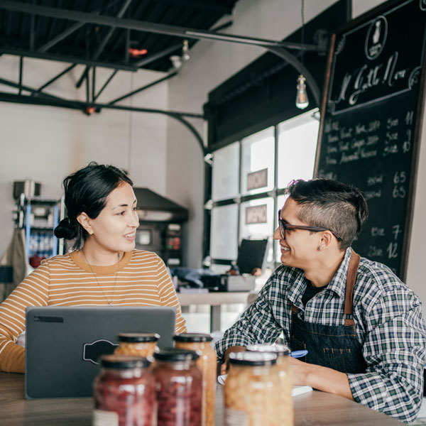 two people talking in cafe