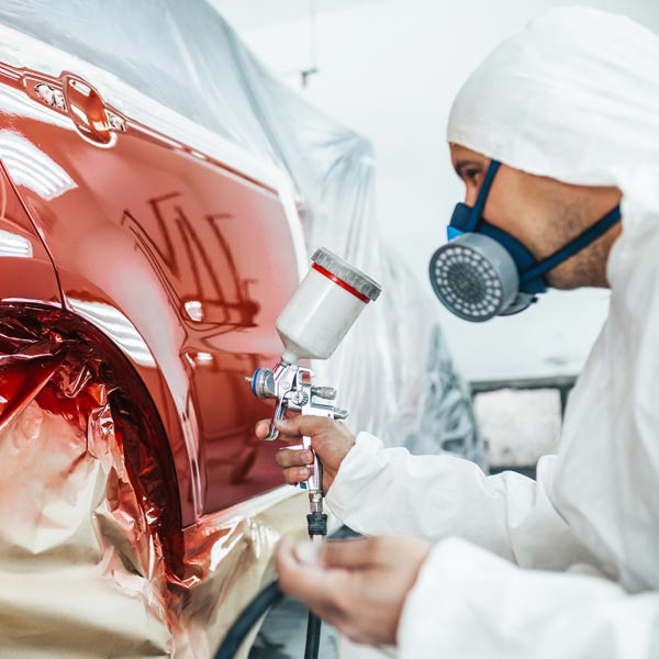 person working in spray booth