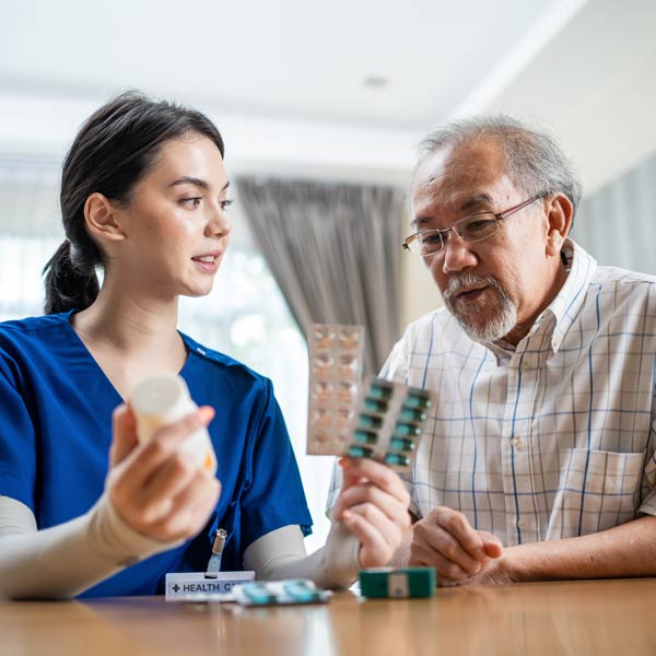 nurse talking about medication with patient