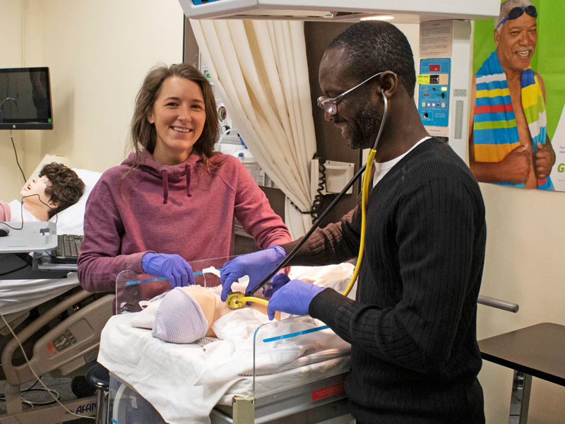 Health program students practicing medical skills in Aurora, CO 