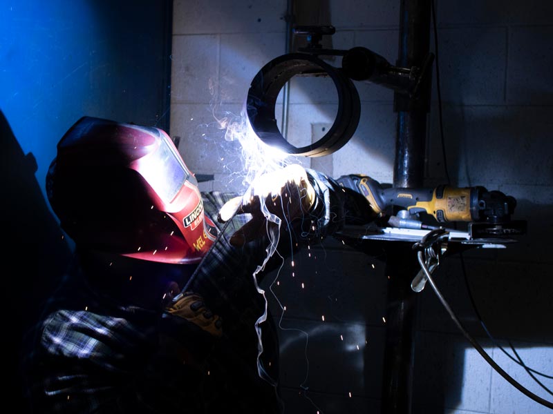 man welding