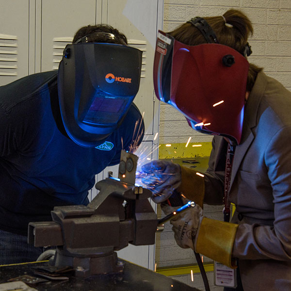 Two Person welding something