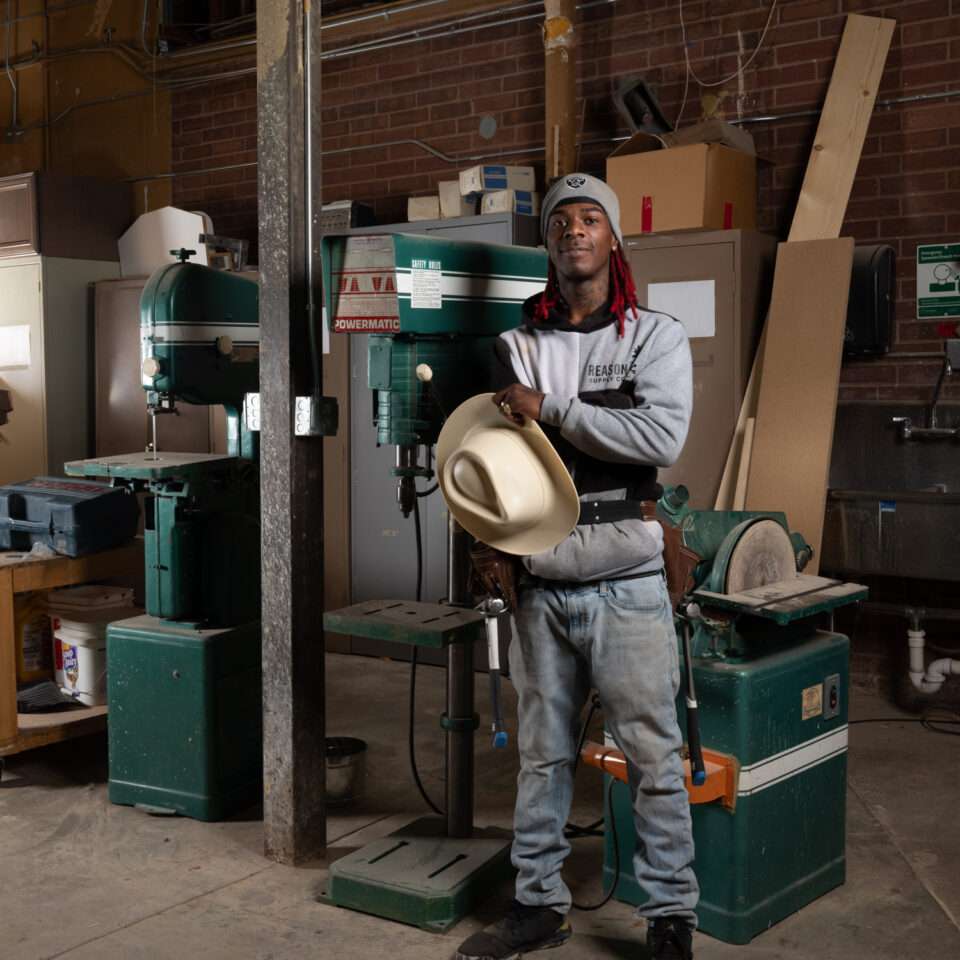 Construction trades student in hands-on workshop training in Aurora, CO
