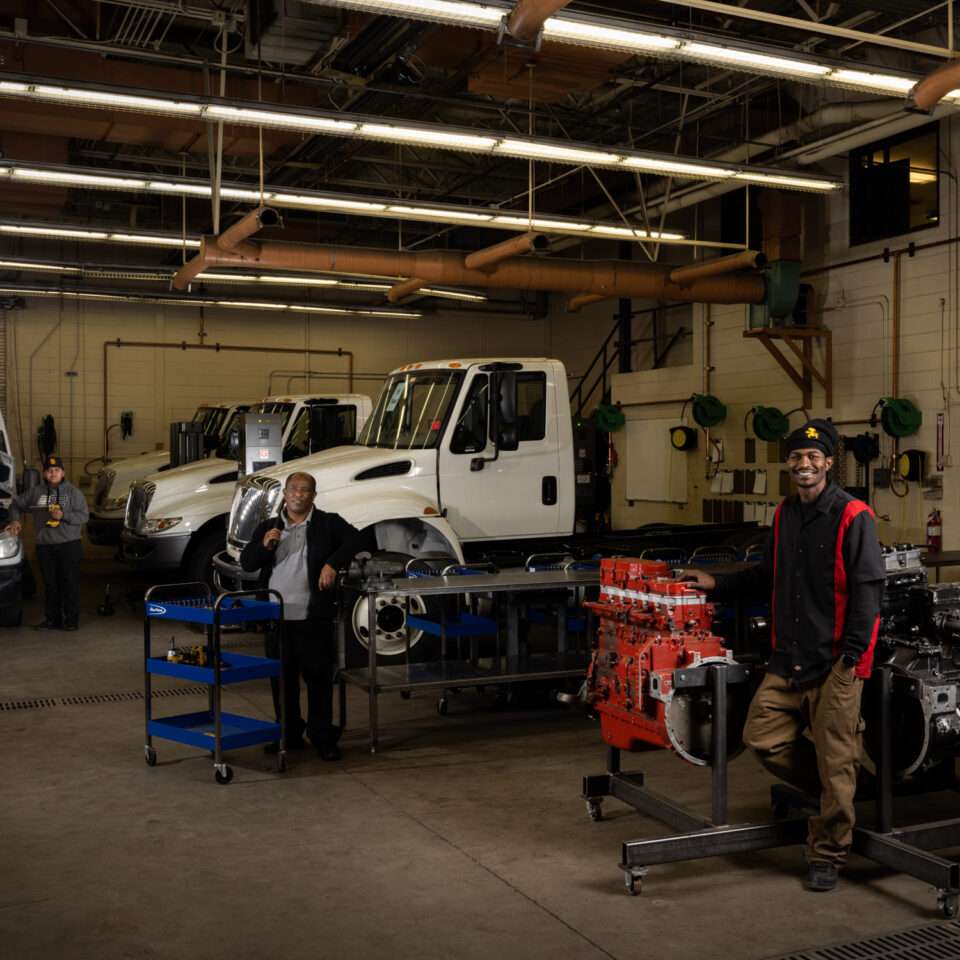 Diesel technician student performing hands-on engine repair training in Aurora, CO
